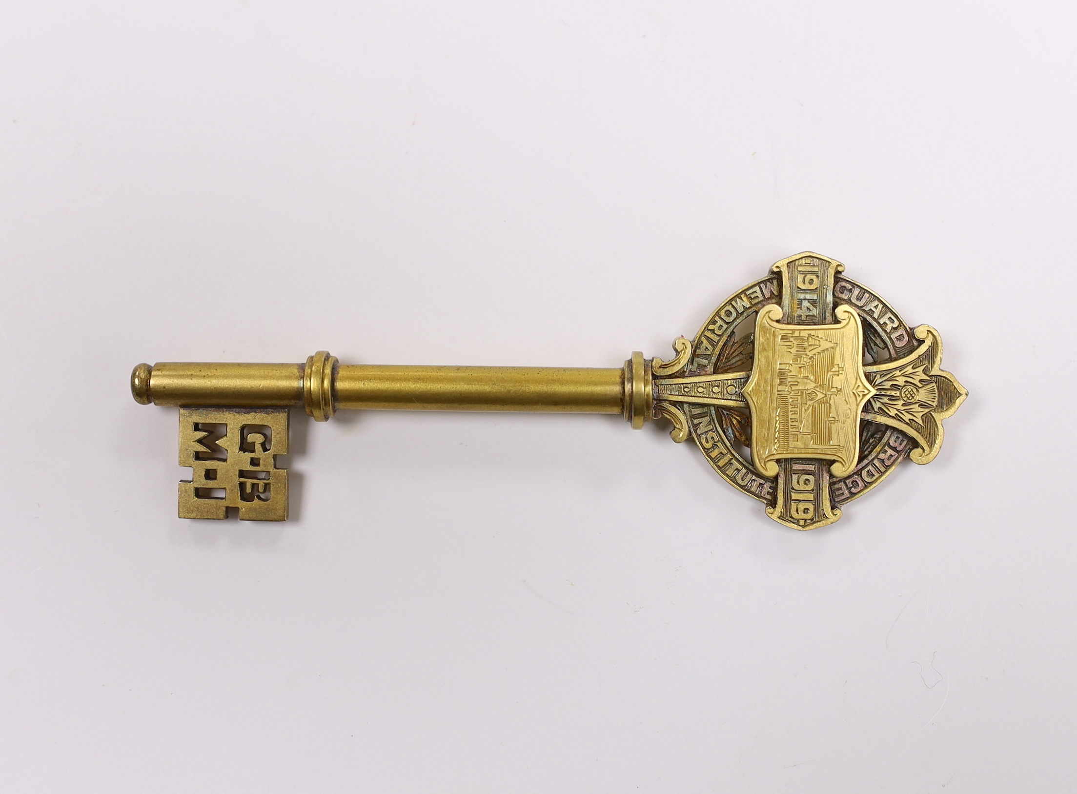 A cased gilt presentation key for the Guard Bridge Memorial Institute 1914 to 1919, presented by the architects, James Gillespie and Scott to W.D. Dixon, in fitted case, key 10.5cm